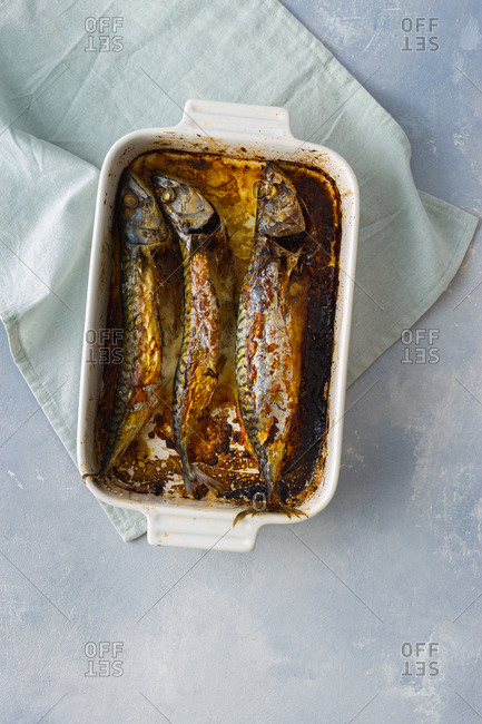 Overhead view of freshly baked mackerel in a baking dish