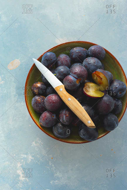 Overhead view of plate full of sweet freshly picked plums