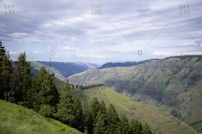 Scenic view of mountains against cloudy sky