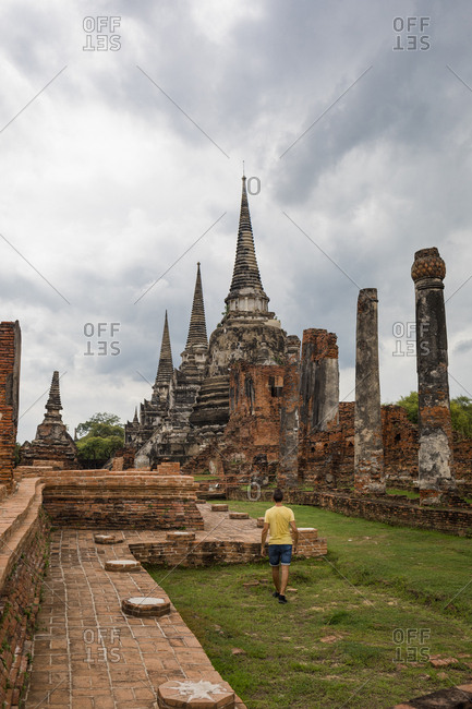 Man visiting Ayutthaya, the ancient city of Thailand