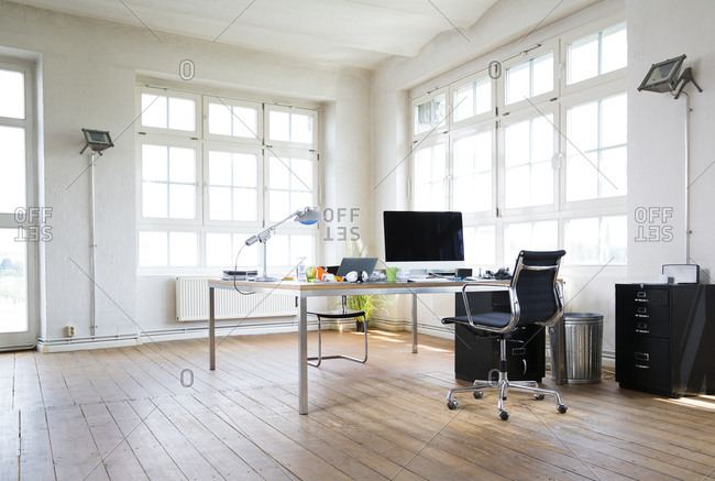 Desk and chair in bright office