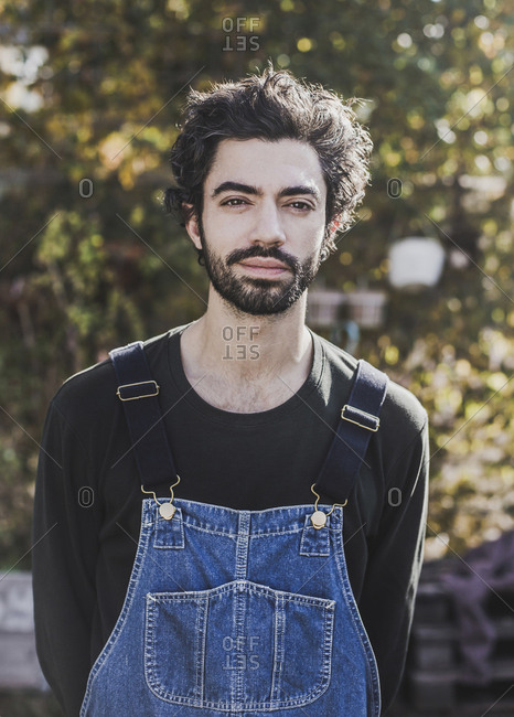 Portrait of bearded man in garden