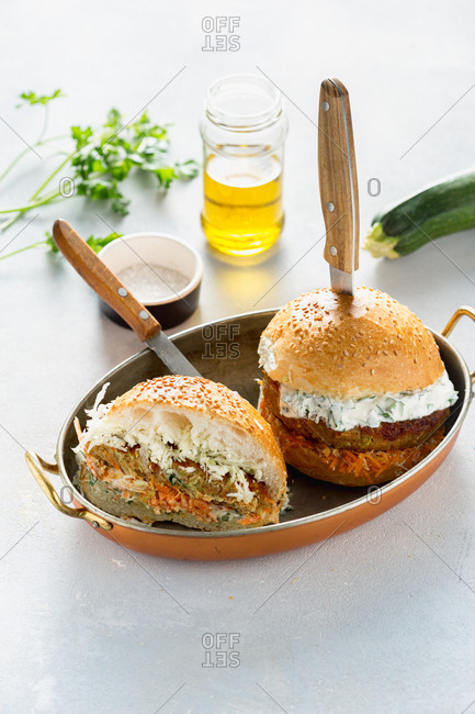 Two vegetarian burgers served in a pan