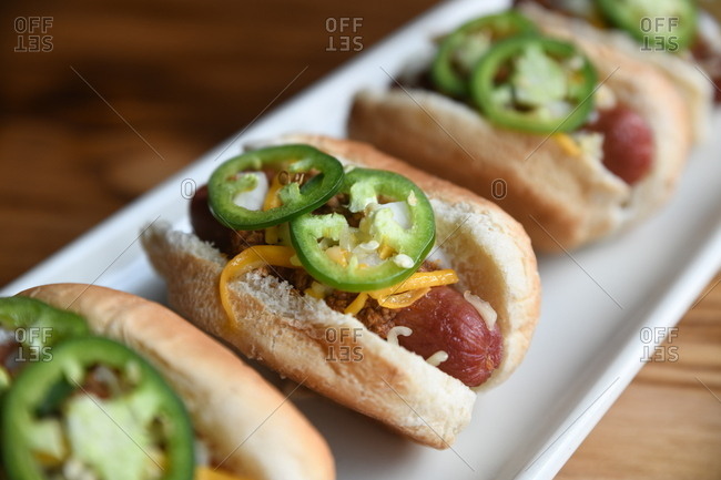 Close up of miniature hot dogs with jalapenos