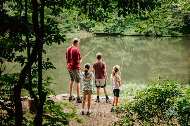 Family fishing in a lake together