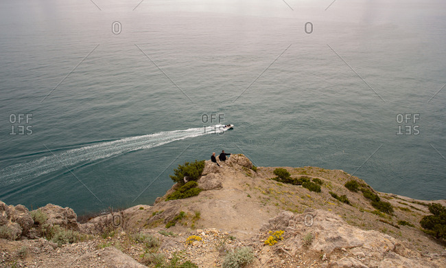 Lonely boat in the black sea cove