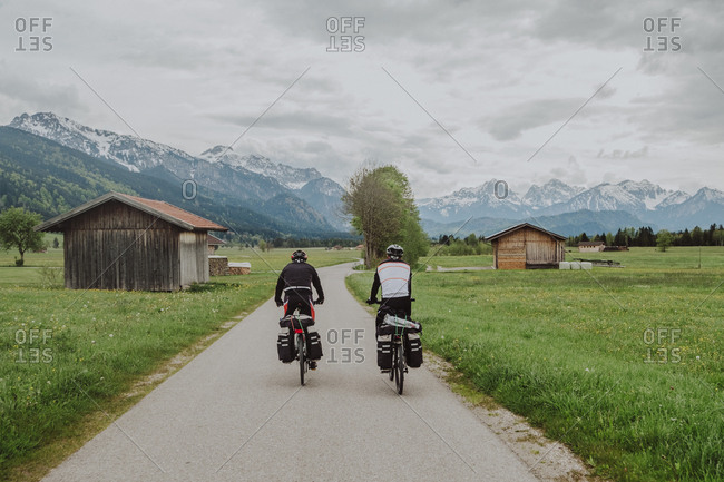 Cyclists ride his bikes in fussen, Germany