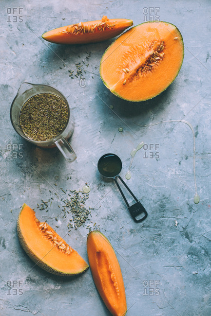 Fresh melon with lavender tea on grey background.