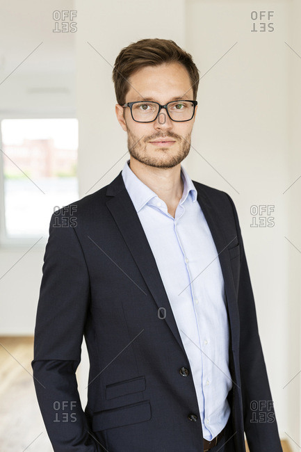Portrait of a confident businessman in an apartment