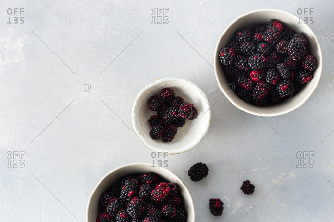 Bowls of fresh blackberries overhead view