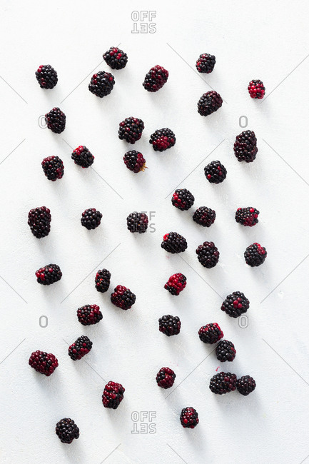 Fresh blackberries scattered on a table