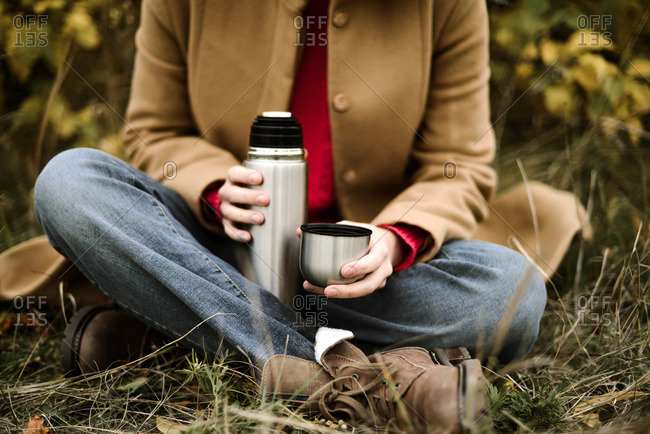 Close-up of Man Holding Thermos and an Iron Mug, Pouring Hot Tea Outdoors.  Selective Focus on Thermo Flask Stock Photo - Image of beverage, iron:  231468226