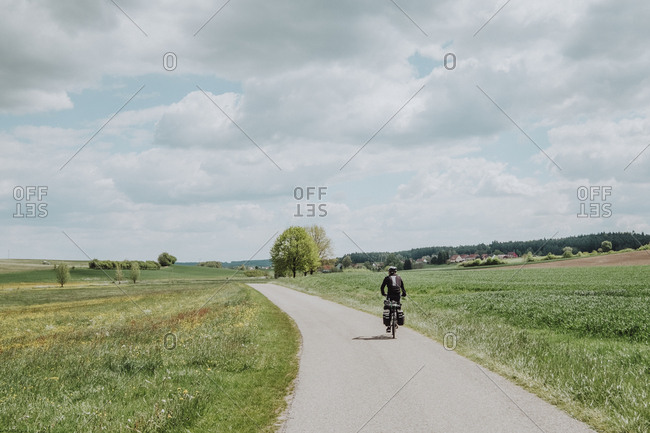 A cyclist riding his bike with bike packing in Germany