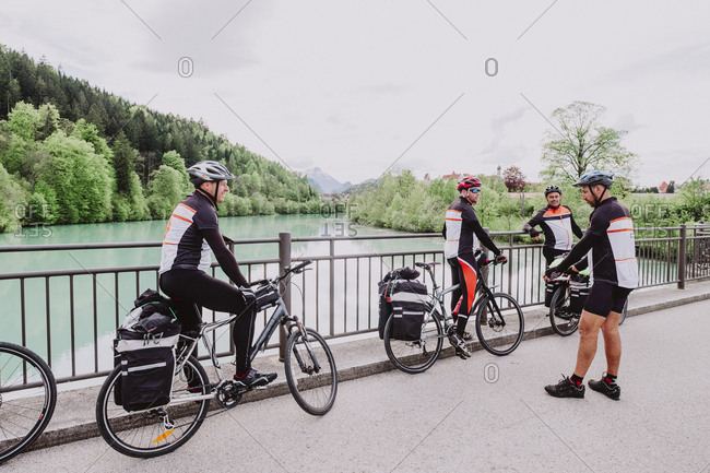 A group of cyclist resting in a river in the Romantische Strasse route