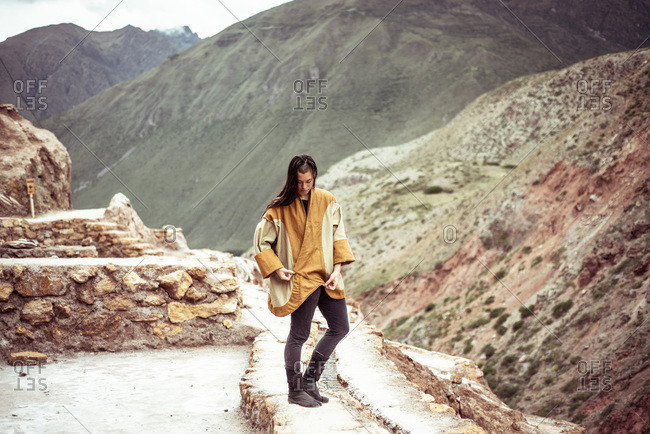 Androgynous mixed race dancer  in salt farm on mountain side