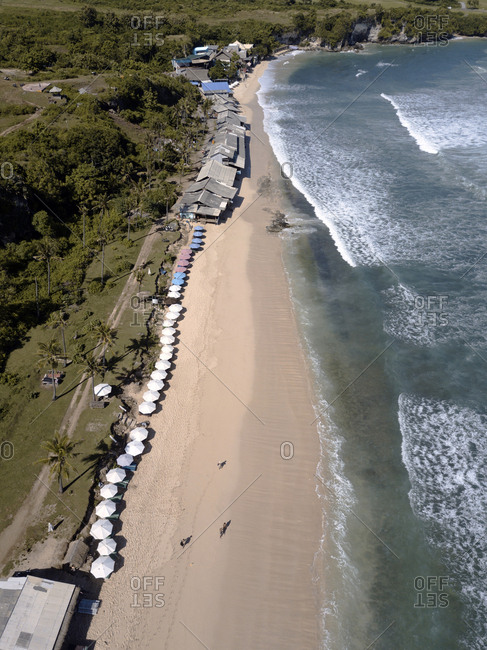 Bird's eye view of people walking on Balangan beach, Bali, Indonesia