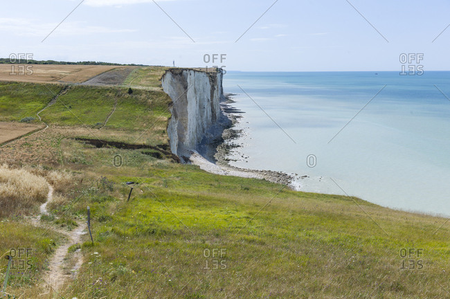 White chalk cliff along blue sea in Somme Bay, France