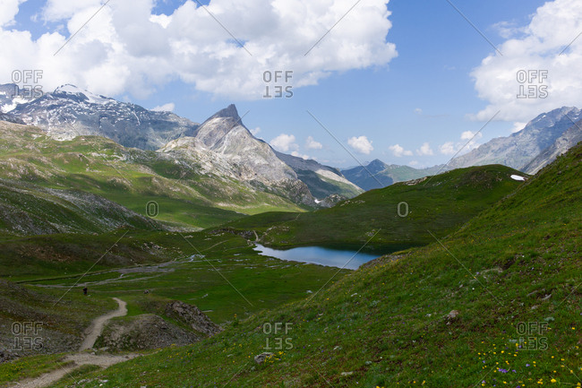 Landscape with mountains, green meadows and lake during a beautiful summer in Northern Europe