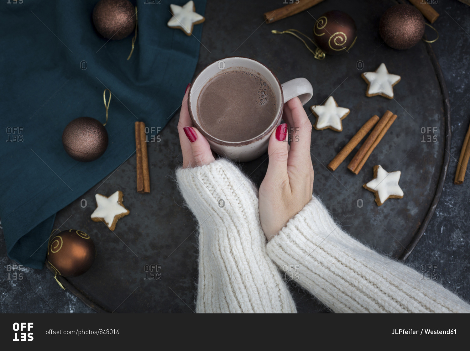 Woman's hands holding cup of Hot Chocolate at Christmas time