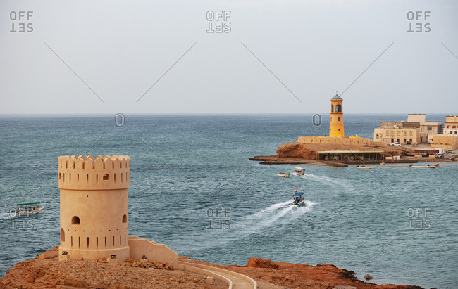 Tower and Sur Lighthouse in the evening- Sur- Oman