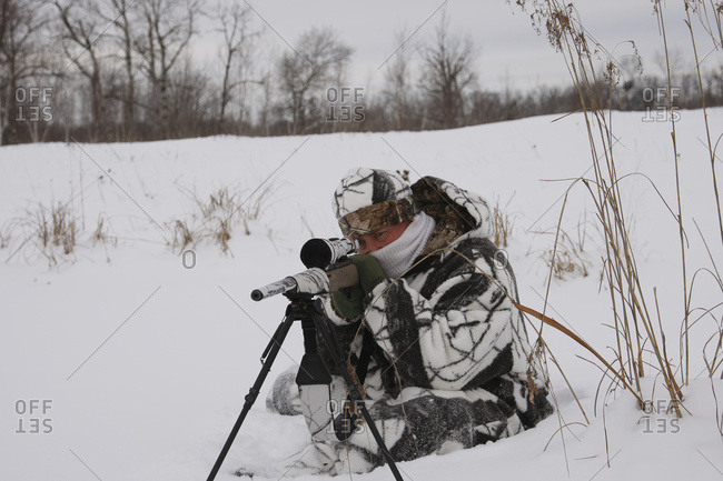 Varmint Hunter With Rifle On Bipod on Prairies