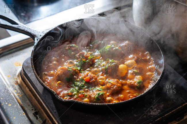 Meatballs dish with sauce cooking in a skillet