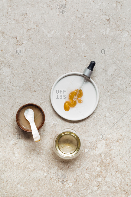 From above photo of pipette  and cosmetic liquid products.