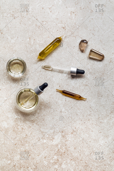 From above photo of ampoule with cosmetic serums.