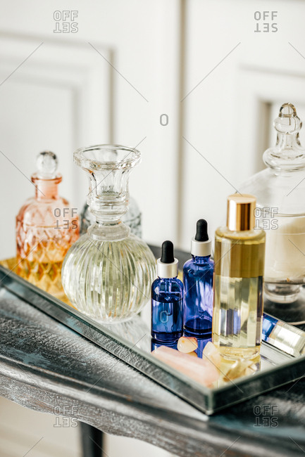 Table with bottles and liquids for aromatherapy.
