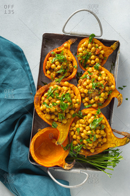 Vegetarian stuffed pumpkin chickpea curry in baking dish