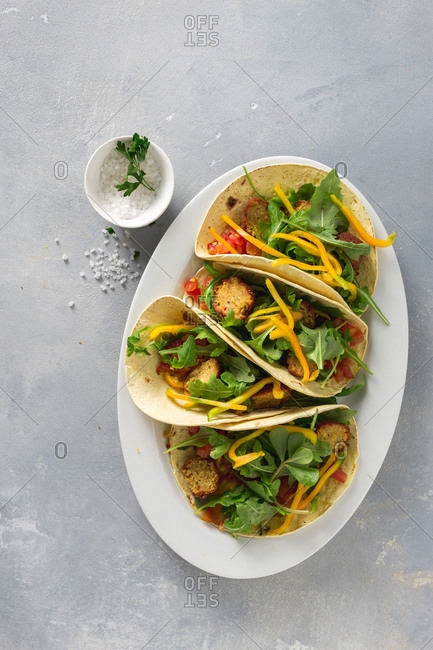 Vegetarian tortilla with falafel and vegetables top view