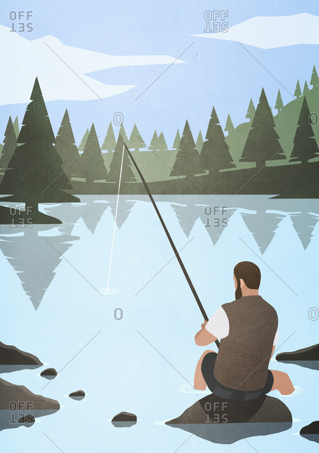 Man fishing on rock in lake