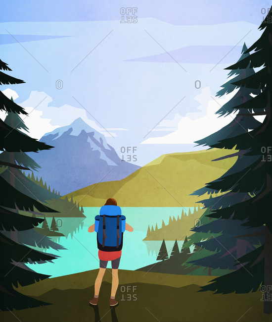Female hiker enjoying scenic lake and mountain view