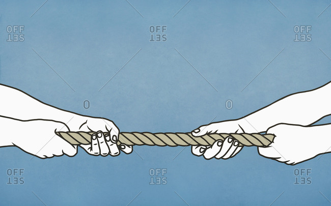 Couple playing tug-of-war with rope