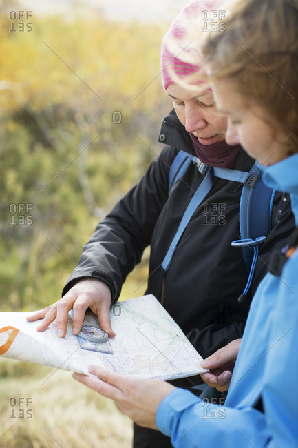 Women using compass and map