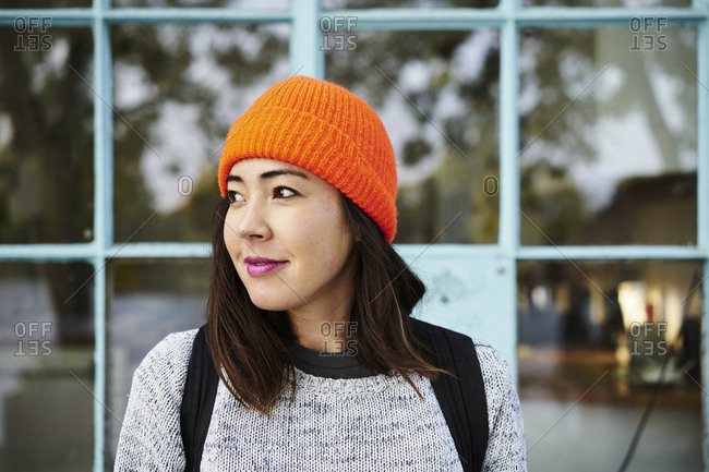 Young woman with orange beanie