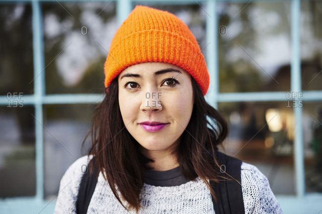 Young woman with orange beanie