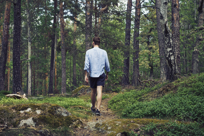 Man walking in forest - Offset