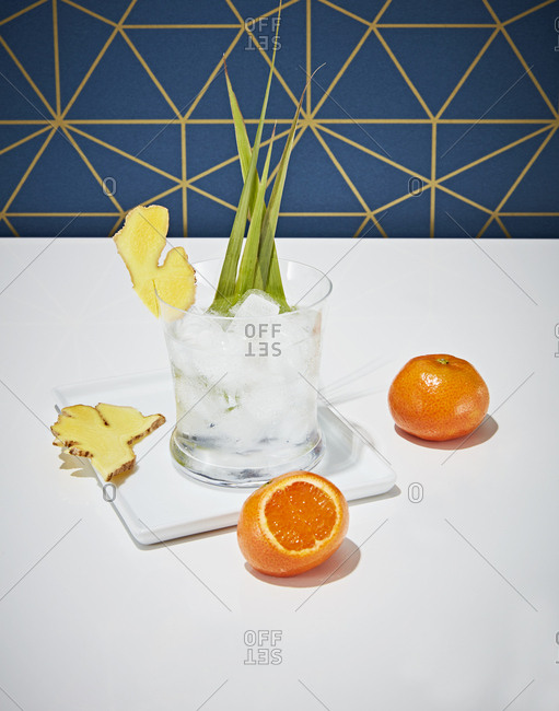 Fancy cocktail with oranges and ginger root