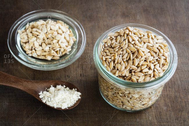 Ancient grains- Einkorn Wheat in glas jar as grain- flakes and flour