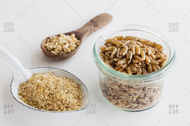 Ancient grains- Polish Wheat in bowl as grain- coarse meal and semolina
