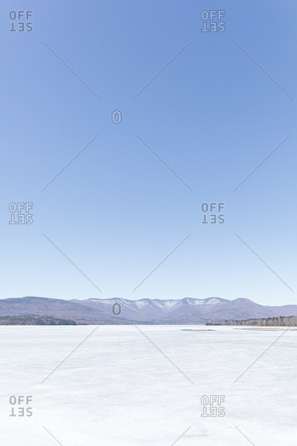 Idyllic shot of frozen ice on Ashokan Reservoir against clear blue sky