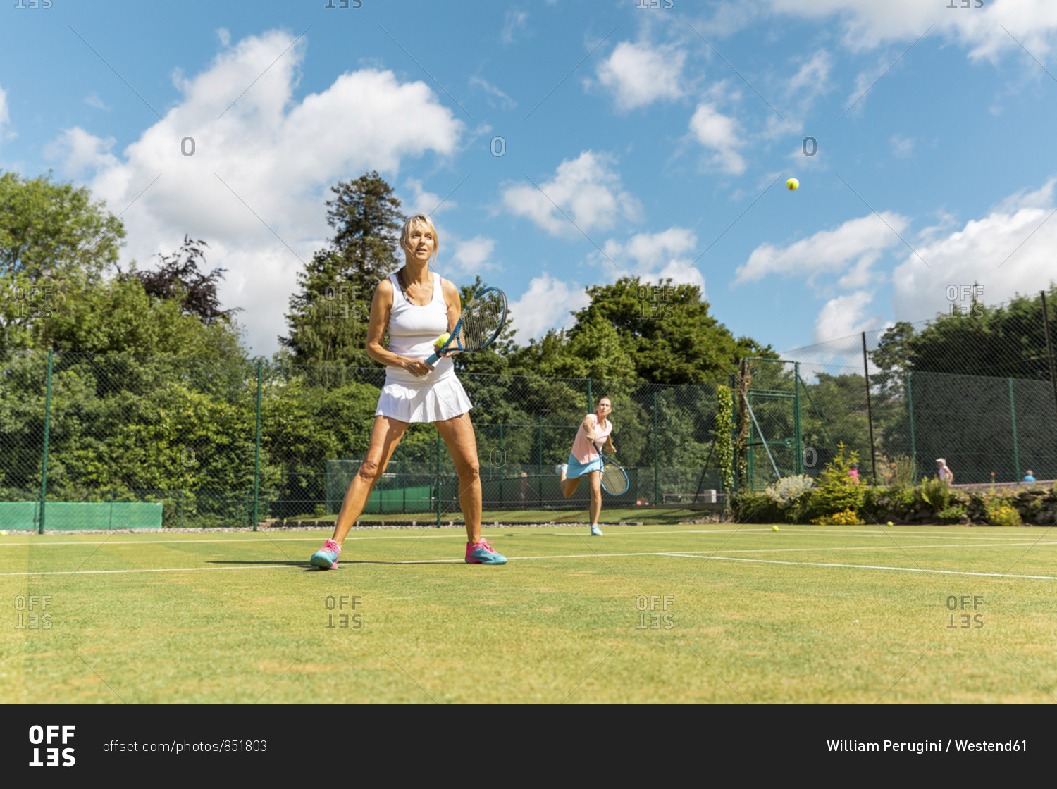 Mature women during a tennis match on grass court