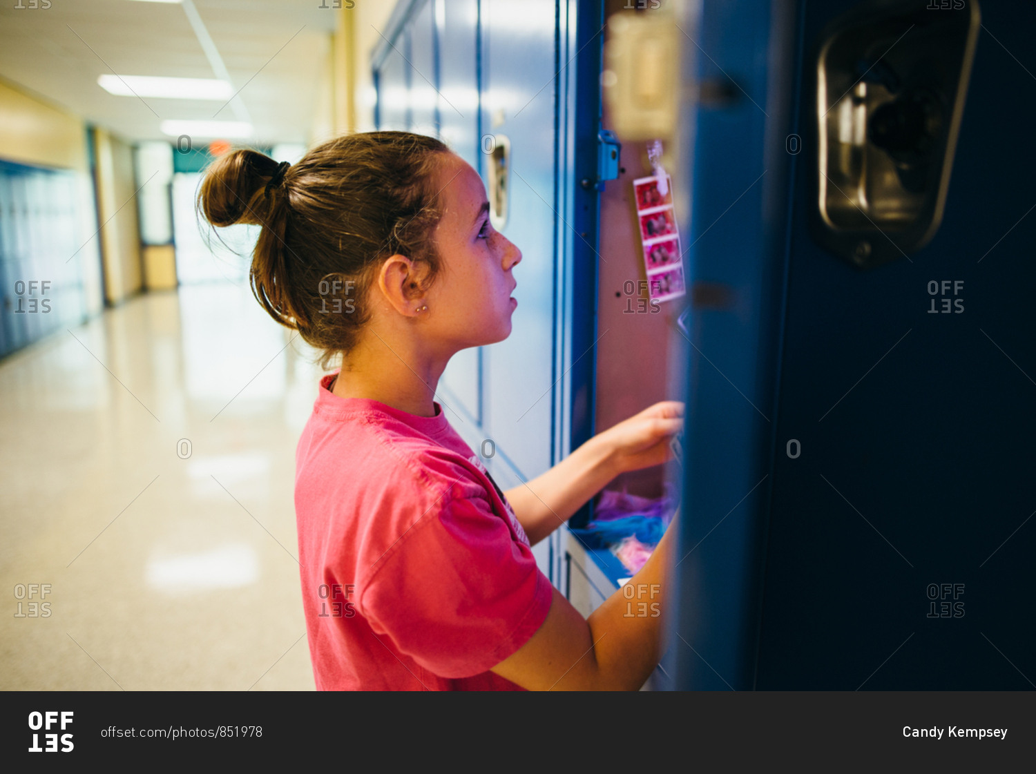 Girl setting up her middle school locker