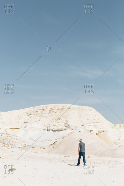 Person hiking in Nitzana Park Rock formation, in Negev Desert Israel