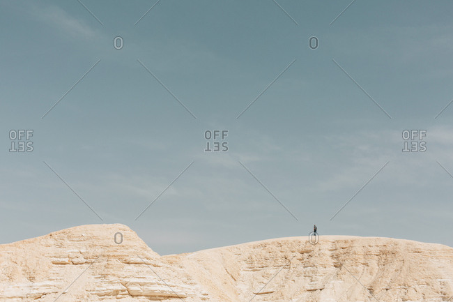 Person hiking in Nitzana Park Rock formation, in Negev Desert Israel