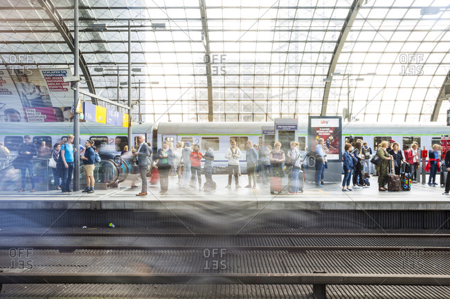 August 31, 2018: Passengers waiting for trains on a platform at the main train station (Hauptbahnhof), Berlin, Germany.