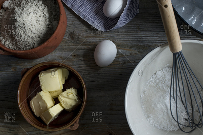 Ingredients of a sorgho cake on a wooden background