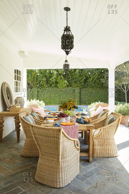 Los Angeles, California - May 17, 2019: Covered patio with wicker chair dining set