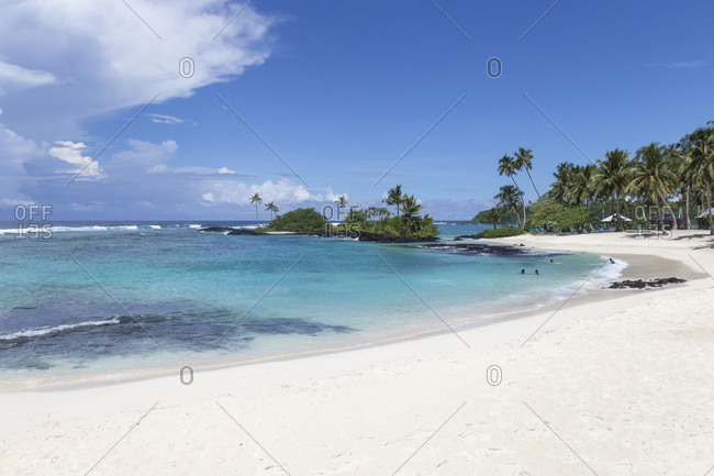 Small clear turquoise waters bay, with sandy white beach (Matareva)